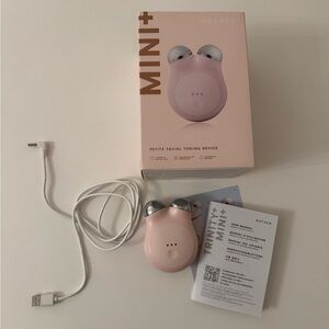NuFace Mini+ microcurrent device in sandy rose pink